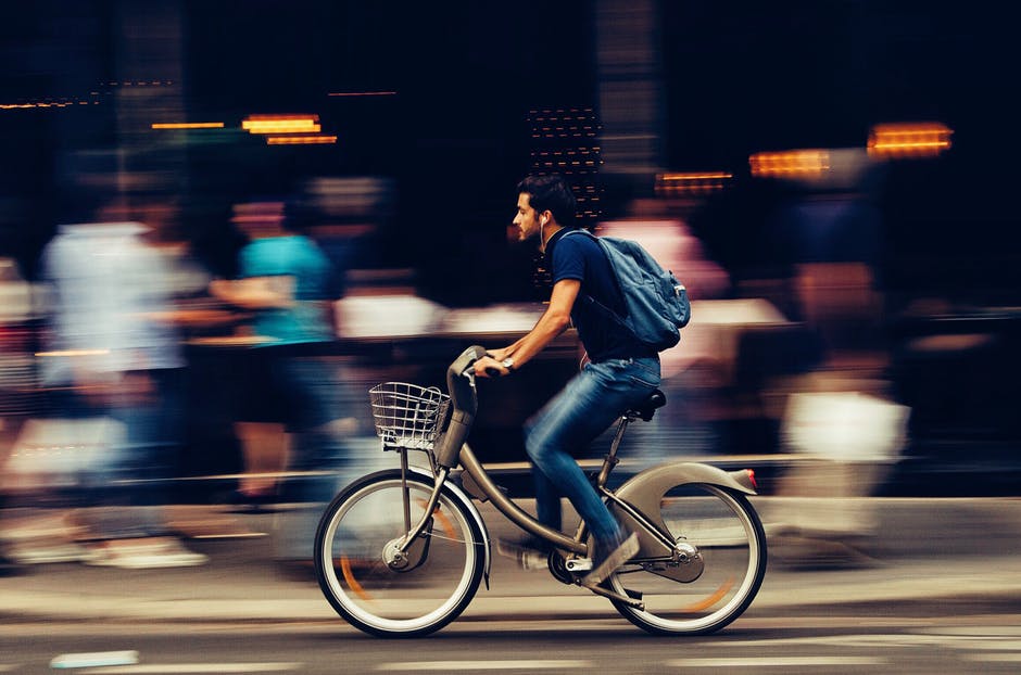 A person riding a bicycle on a city street