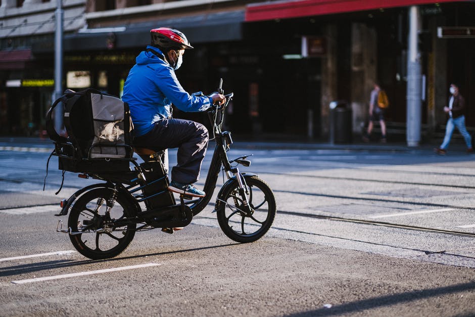A man riding a bicycle on a city street